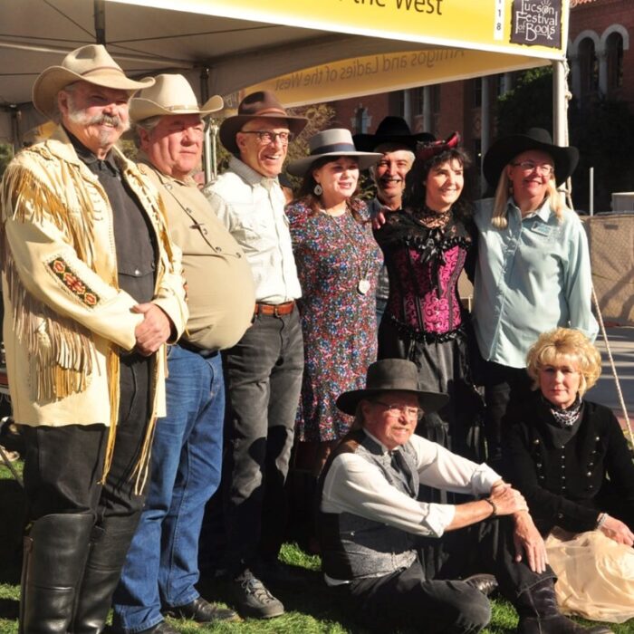 Authors of Amigos and Ladies of the West - front seated Rod Timanus, Chris Enss, standing from left to right Doug Hocking, Lowell Volk, Gil Storms, Carol Markstrom, Manuela Schneider, and Melody Groves
