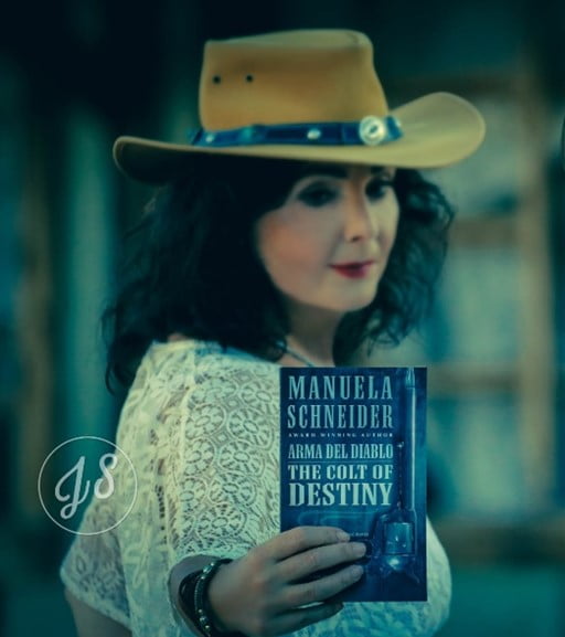 Manuela Schneider Holding Her Book - The Colt Of Destiny