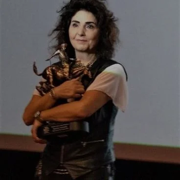 Manuela Schneider Holding the Charlier LeSueur Award - Featured Image